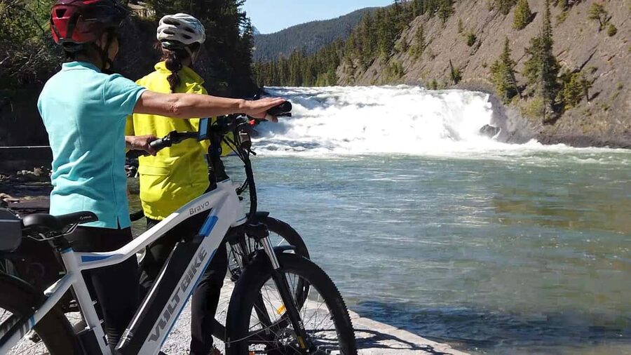 BANFF EVENING eBIKE WILDLIFE TOUR - Leaving downtown Banff for Bow Falls