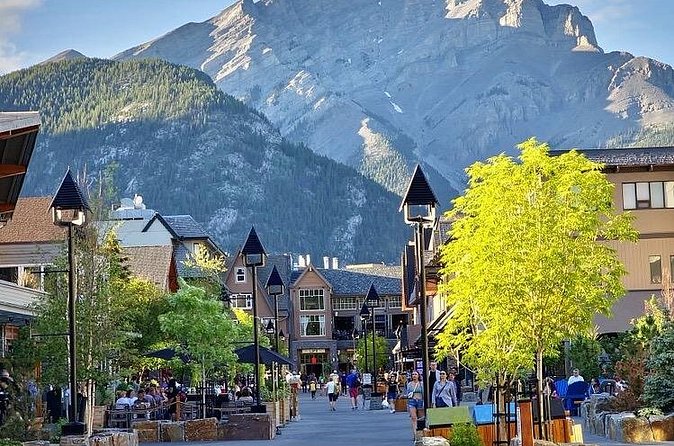 Banff Gondola Hot Springs Bow Falls and Three Lakes tour - Lake Minnewanka and the story beneath the water