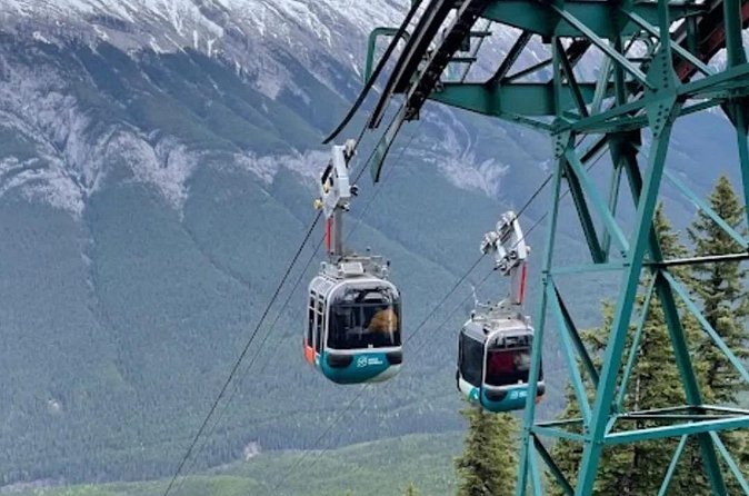 Banff Gondola Hot Springs Bow Falls and Three Lakes tour - The Banff sign and a quick final photograph
