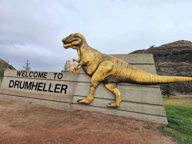 From Calgary: Drumheller Private Tour, Full day sightseeing - The Drumheller sign and Starmine Suspension Bridge