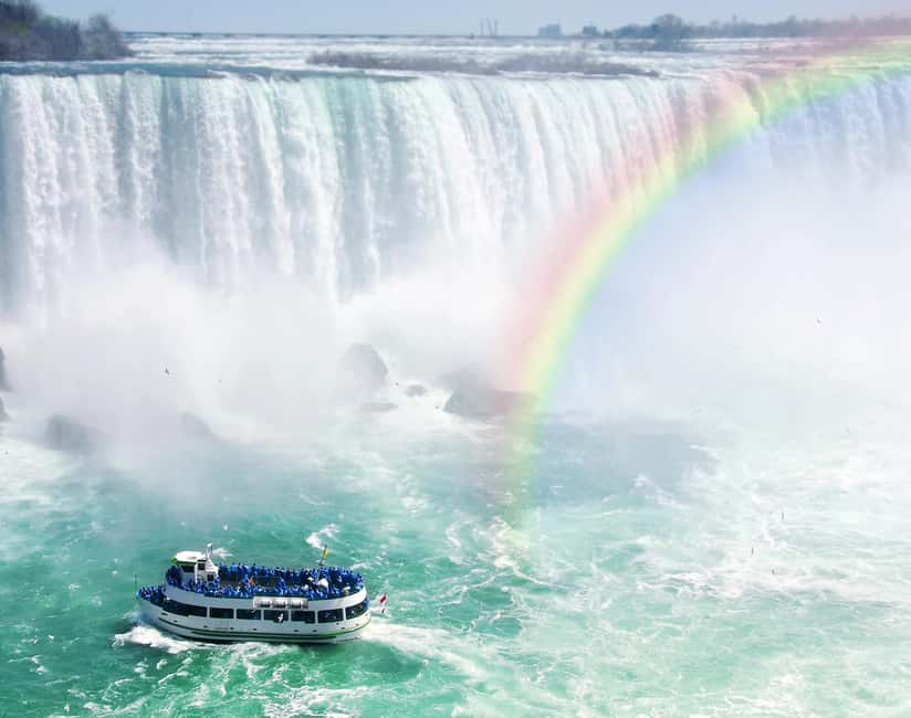 From Toronto: Niagara Falls Bus Tour with Boat Cruise - The Hornblower boat and the spray zone
