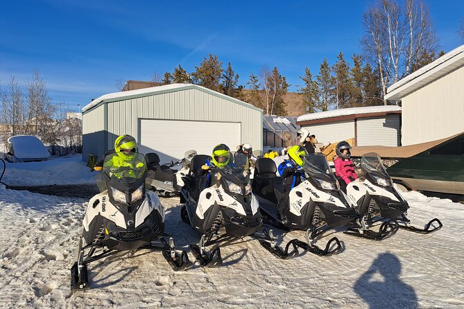 Guided Snowmobile Adventure - Crossing frozen lakes and entering the forest
