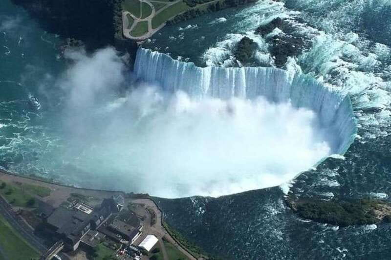 Toronto to Niagara Falls: Boat Ride & Behind the falls Tour - Niagara Falls from the water